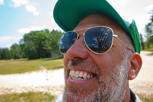 MIKE DEAL / WINNIPEG FREE PRESS
Festival Tower is reflected in Artistic Director Chris Frayer's sunglasses while on a tour at the Folk Festival site in Birdshill Provincial Park.
See Ben Waldman story
210707 - Wednesday, July 07, 2021.