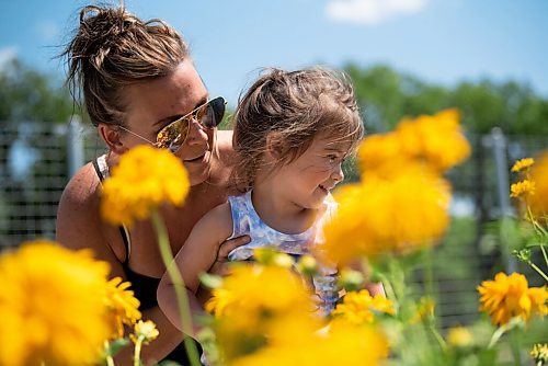 ALEX LUPUL / WINNIPEG FREE PRESS  

Cynthia Nault and her daughter Aurora Guenette, 3, look at the flowers together at the Outdoor Gardens at The Leaf on Friday, July 9, 2021. The gardens officially opened to the public on Friday.

Reporter: Gillian Brown