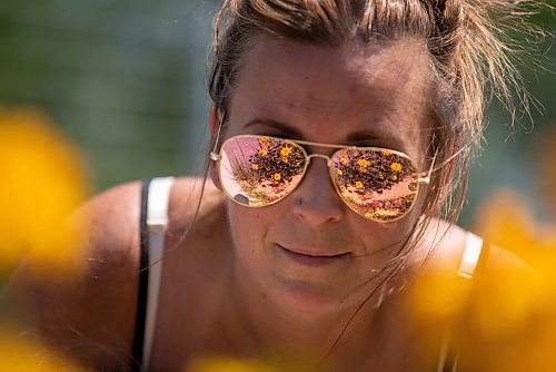 ALEX LUPUL / WINNIPEG FREE PRESS  

Flowers can be seen in the reflection of Cynthia Nault's mirrored sunglasses at the Outdoor Gardens at The Leaf on Friday, July 9, 2021. The gardens officially opened to the public on Friday.

Reporter: Gillian Brown