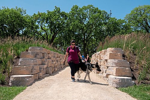 ALEX LUPUL / WINNIPEG FREE PRESS  

Monique Buttazoni and her dog Vince go for a walk at the Outdoor Gardens at The Leaf on Friday, July 9, 2021. The gardens officially opened to the public on Friday.

Reporter: Gillian Brown