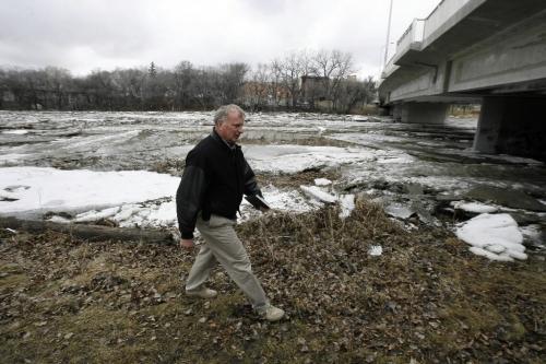 MIKE.DEAL@FREEPRESS.MB.CA 100403 - Saturday, April 3rd, 2010 Steven Topping Executive Director for Manitoba Water Stewardship arrives at the Maryland Street Bridge where an ice jam has caused the Assiniboine river to back up and rise a bit. See Melissa Martin story MIKE DEAL / WINNIPEG FREE PRESS