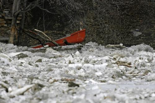 MIKE.DEAL@FREEPRESS.MB.CA 100403 - Saturday, April 3rd, 2010 A canoe is lodged in an ice jam has caused the Assiniboine river to back up and rise a bit. See Melissa Martin story MIKE DEAL / WINNIPEG FREE PRESS