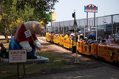 Daniel Crump / Winnipeg Free Press. People ride the tinkertpwn train as they enjoy a very warm Saturday afternoon at the amusement park. July 10, 2021.