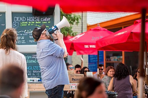 MIKAELA MACKENZIE / WINNIPEG FREE PRESS

Jesse Millar announces the start of Bullrider's set at Blue Note Park in Winnipeg on Friday, July 9, 2021. For Melissa Martin story.
Winnipeg Free Press 2021.