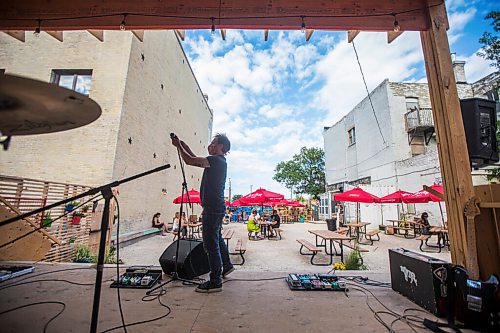 MIKAELA MACKENZIE / WINNIPEG FREE PRESS

Greg Rekus sets up the sound system before Bullrider plays at Blue Note Park in Winnipeg on Friday, July 9, 2021. For Melissa Martin story.
Winnipeg Free Press 2021.