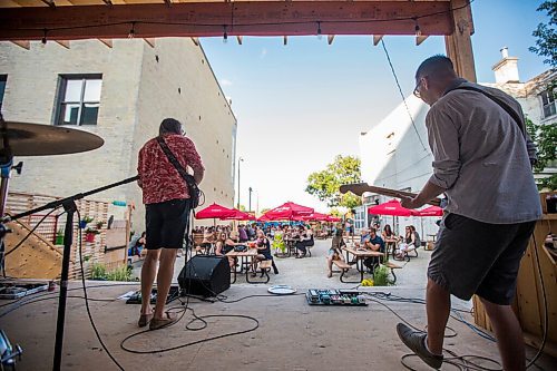 MIKAELA MACKENZIE / WINNIPEG FREE PRESS

Bullrider (Bobby Desjarlais, left, and Ben Ferguson) plays to a packed house at Blue Note Park in Winnipeg on Friday, July 9, 2021. For Melissa Martin story.
Winnipeg Free Press 2021.