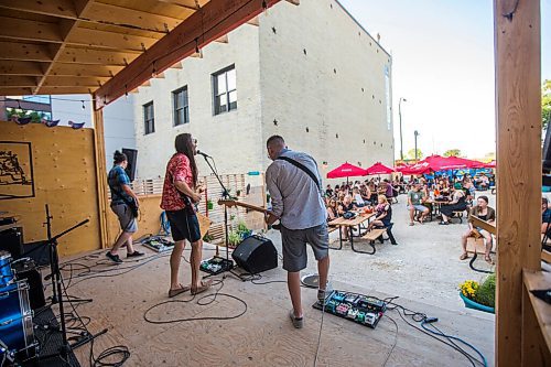 MIKAELA MACKENZIE / WINNIPEG FREE PRESS

Bullrider (Chris Peluk, left, Bobby Desjarlais, and Ben Ferguson) plays to a packed house at Blue Note Park in Winnipeg on Friday, July 9, 2021. For Melissa Martin story.
Winnipeg Free Press 2021.