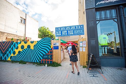 MIKAELA MACKENZIE / WINNIPEG FREE PRESS

Folks walk into the beer garden before Bullrider plays at Blue Note Park in Winnipeg on Friday, July 9, 2021. For Melissa Martin story.
Winnipeg Free Press 2021.