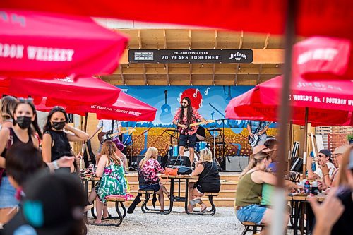 MIKAELA MACKENZIE / WINNIPEG FREE PRESS

Bobby Desjarlais sings as his band, Bullrider, plays to a packed house at Blue Note Park in Winnipeg on Friday, July 9, 2021. For Melissa Martin story.
Winnipeg Free Press 2021.