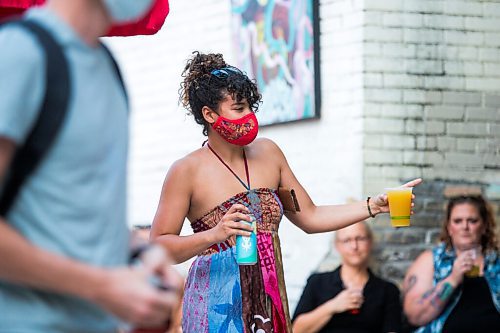 MIKAELA MACKENZIE / WINNIPEG FREE PRESS

Claire Boyd brings drinks back to her table as Bullrider plays to a packed house at Blue Note Park in Winnipeg on Friday, July 9, 2021. For Melissa Martin story.
Winnipeg Free Press 2021.