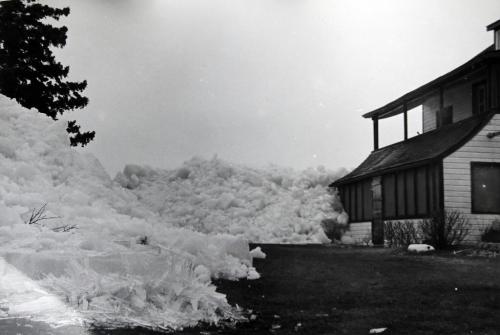 BORIS.MINKEVICH@FREEPRESS.MB.CA  100404 BORIS MINKEVICH / WINNIPEG FREE PRESS Ann Cook with a photo from the 60's of a similar Lake Winnipeg ice pile formed on her family's property. A massive pile of lake ice at Stephenson Point near Winnipeg Beach.