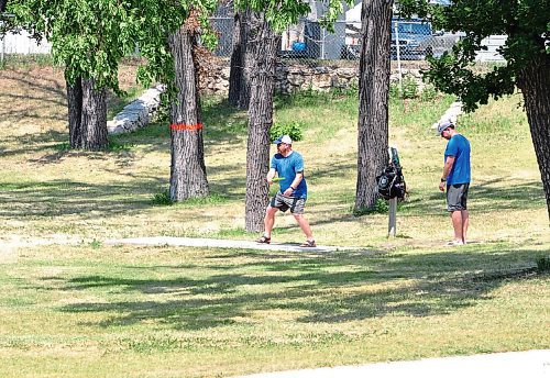 Canstar Community News St. Vital photographer Tony Nardella caught some frisbee golf players in action at Happyland Park at the corner of Marion and Archibald.