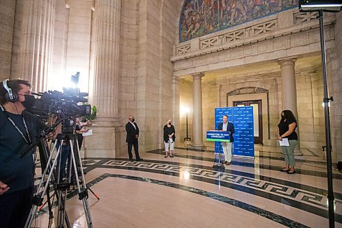 MIKAELA MACKENZIE / WINNIPEG FREE PRESS

Justice minister Cameron Friesen (centre) and Victims Assistance Community Grants Inc. board members Ron Evans (left), Wilma Derksen, and Cydney Bergen speak about new funding supports for victims of crime at an announcement at the Manitoba Legislative Building in Winnipeg on Tuesday, July 13, 2021. For Dylan Robertson story.
Winnipeg Free Press 2021.