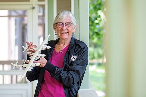 MIKAELA MACKENZIE / WINNIPEG FREE PRESS

Judy Anderson, a Winnipegger who has made a down payment for a spot on billionaire Richard Branson's spaceship, poses for a photo with a model of the Virgin Galactic rocket plane in Winnipeg on Tuesday, July 13, 2021. For Maggie story.
Winnipeg Free Press 2021.