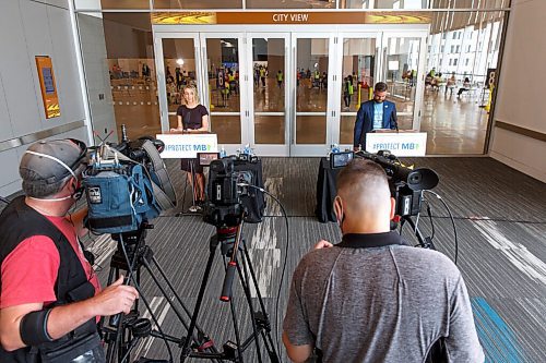 MIKE DEAL / WINNIPEG FREE PRESS
Dr. Joss Reimer, medical lead, Vaccine Implementation Task Force and Johanu Botha, operations, planning and logistics lead, Vaccine Implementation Task Force speak from the vaccine super site, RBC Convention Centre, 375 York Ave, providing the COVID-19 vaccine update during what the government is calling a vaccin-athon, Wednesday afternoon.
210714 - Wednesday, July 14, 2021.