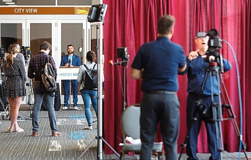 MIKE DEAL / WINNIPEG FREE PRESS
Johanu Botha, operations, planning and logistics lead, Vaccine Implementation Task Force speaks from the vaccine super site, RBC Convention Centre, 375 York Ave, while an American Sign Language (ASL) interpreter (right) translates for a livestream providing the COVID-19 vaccine update during what the government is calling a vaccin-athon, Wednesday afternoon.
210714 - Wednesday, July 14, 2021.