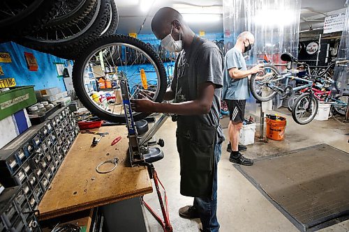 JOHN WOODS / WINNIPEG FREE PRESS
Abdull (L) and Jacek Siudowski work on bikes at The Wrench in Winnipeg Wednesday, July 14, 2021. The Wrench is holding an Empty The Fill event at the Brady Landfill this weekend.

Reporter: ?