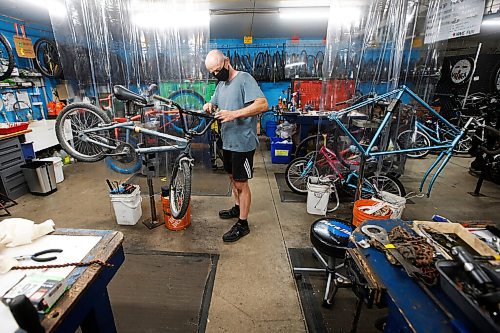 JOHN WOODS / WINNIPEG FREE PRESS
Jacek Siudowski work on bikes at The Wrench in Winnipeg Wednesday, July 14, 2021. The Wrench is holding an Empty The Fill event at the Brady Landfill this weekend.

Reporter: ?