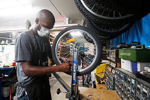 JOHN WOODS / WINNIPEG FREE PRESS
Abdull works on bikes at The Wrench in Winnipeg Wednesday, July 14, 2021. The Wrench is holding an Empty The Fill event at the Brady Landfill this weekend.

Reporter: ?