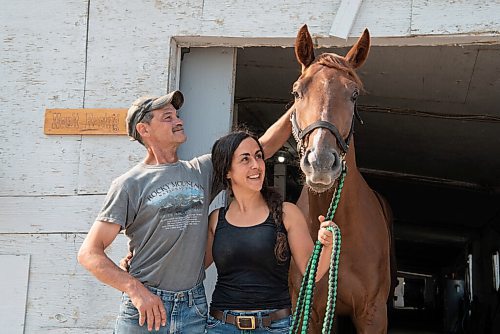 ALEX LUPUL / WINNIPEG FREE PRESS  

Trainer Mike Nault and assistant trainer Hanna Dilts are photographed with Flash of Glory, a local derby favourite, on Thursday, July 15, 2021.

Reporter: George Williams