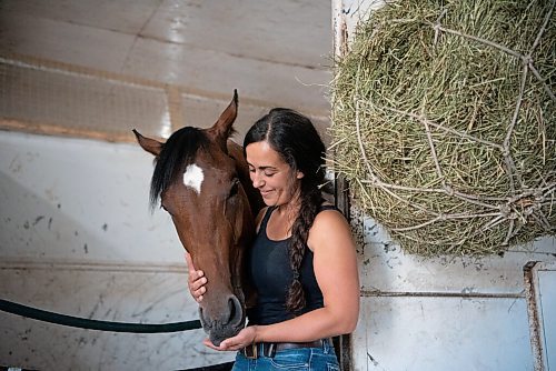 ALEX LUPUL / WINNIPEG FREE PRESS  

Assistant trainer Hanna Dilts is photographed with Bankin On Betty, the first two-year old winner of the year, on Thursday, July 15, 2021.

Reporter: George Williams
