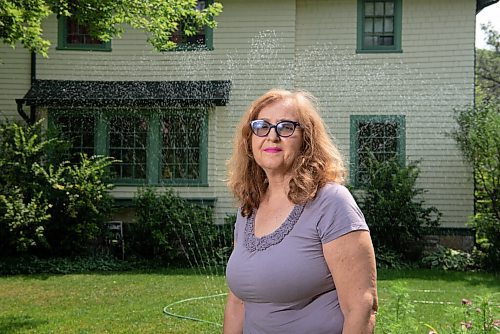 ALEX LUPUL / WINNIPEG FREE PRESS  

Robyn Rypp poses for a portrait in front of her Winnipeg home on Thursday, July 15, 2021. Rypp waters her lawn in River Heights twice a week, trying to keep it alive during heat and drought.

Reporter: Cody Sellar