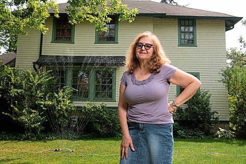 ALEX LUPUL / WINNIPEG FREE PRESS  

Robyn Rypp poses for a portrait in front of her Winnipeg home on Thursday, July 15, 2021. Rypp waters her lawn in River Heights twice a week, trying to keep it alive during heat and drought.

Reporter: Cody Sellar