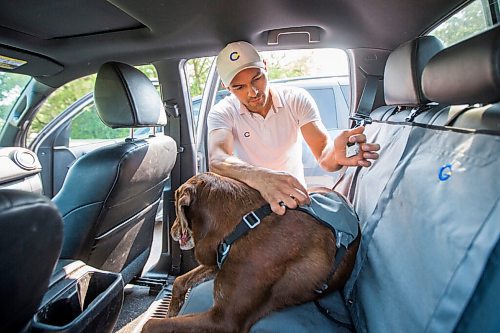 MIKAELA MACKENZIE / WINNIPEG FREE PRESS

Gordon Templeton and his dog, Nala, demonstrate the dog restraint and leash system that Templeton created in Winnipeg on Friday, July 16, 2021. For Dave Sanderson story.
Winnipeg Free Press 2021.