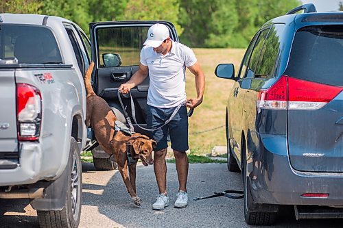 MIKAELA MACKENZIE / WINNIPEG FREE PRESS

Gordon Templeton and his dog, Nala, demonstrate the dog restraint and leash system that Templeton created in Winnipeg on Friday, July 16, 2021. For Dave Sanderson story.
Winnipeg Free Press 2021.