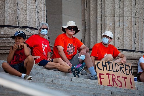 Daniel Crump / Winnipeg Free Press. Protestors hold signs at the ProtectEdMB rally at the Manitoba legislature, Saturday morning. The rally was organized as a response to comments made by premier Brian Pallister and Indigenous relations minister, Alan Lagimodiere. July 17, 2021.