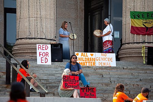Daniel Crump / Winnipeg Free Press. Sisters, Yvette Doell (left) and Lisa Aymont Hunter (right) sing and drum at the ProtectEdMB rally at the Manitoba legislature, Saturday morning. The rally was organized as a response to comments made by premier Brian Pallister and Indigenous relations minister, Alan Lagimodiere. July 17, 2021.
