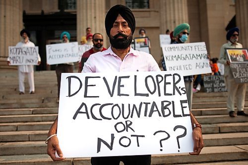 Daniel Crump / Winnipeg Free Press. Dalvinder Toor holds a sign during a protest at the Manitoba legislature hoping to draw attention to delays in the development of a park in the Waterford Green neighbourhood. The park is meant to commemorate the Komagata Maru incident during which 352 people from the Punjab province were turned away from entering Canada under the countries exclusion laws. July 17, 2021.