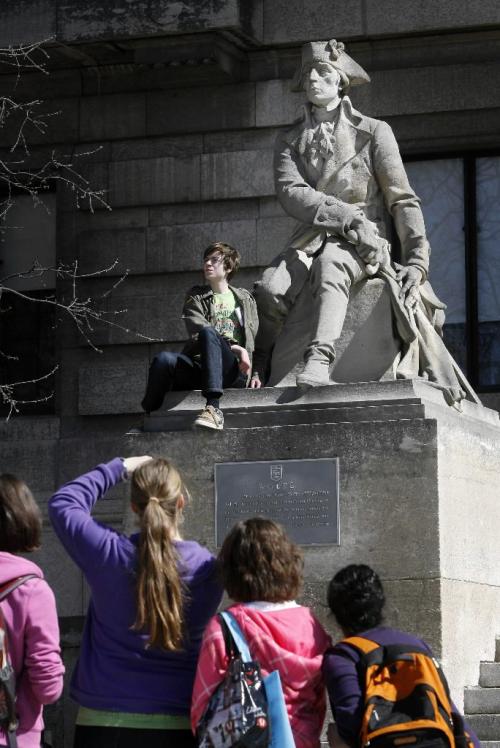 MIKE.DEAL@FREEPRESS.MB.CA 100407 - Wednesday, April 7th, 2010 Adam Fuhr has his picture taken at the Manitoba Legislature at the feet of a statue of Major General James Wolfe. MIKE DEAL / WINNIPEG FREE PRESS