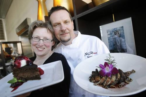 MIKE.DEAL@FREEPRESS.MB.CA 100407 - Wednesday, April 7th, 2010 Restaurant review Mise Bistro Sue and Terry Gereta with Flourless Chocolate Cake topped with house made honey ice cream and Wild Berry Compote and the Roasted Canadian Quail Stuffed with Bison. MIKE DEAL / WINNIPEG FREE PRESS