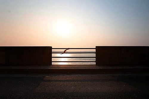 JOHN WOODS / WINNIPEG FREE PRESS
A MMIWG red ribbon flutters in the wind on the Winnipeg River hydro dam bridge in Powerview, Monday, July 19, 2021. 

Reporter: Thorpe