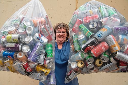 ALEX LUPUL / WINNIPEG FREE PRESS  

Denise Gow poses for a portrait outside of her apartment in Winnipeg on Tuesday, July 20, 2021. Gow collects aluminum pop cans and gives them to Khartum Shrine's Kans for Kids program. Kans for Kids recycles the cans and uses the proceeds for its patient transportation fund.

Reporter: Aaron Epp