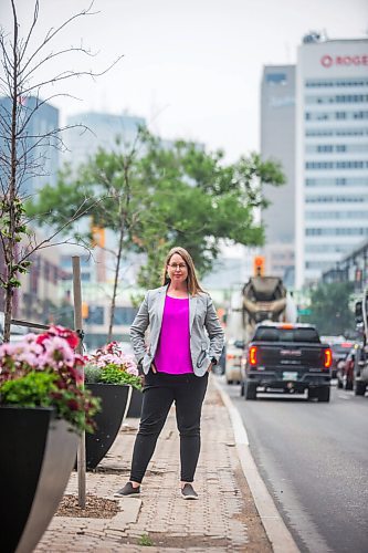 MIKAELA MACKENZIE / WINNIPEG FREE PRESS

Kate Fenske, executive director of the Downtown BIZ, poses for a portrait on Portage Avenue in Winnipeg on Tuesday, July 20, 2021. For Ben Waldman story.
Winnipeg Free Press 2021.