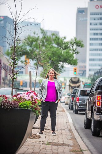 MIKAELA MACKENZIE / WINNIPEG FREE PRESS

Kate Fenske, executive director of the Downtown BIZ, poses for a portrait on Portage Avenue in Winnipeg on Tuesday, July 20, 2021. For Ben Waldman story.
Winnipeg Free Press 2021.