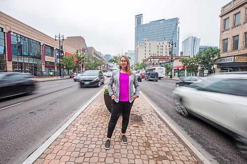 MIKAELA MACKENZIE / WINNIPEG FREE PRESS

Kate Fenske, executive director of the Downtown BIZ, poses for a portrait on Portage Avenue in Winnipeg on Tuesday, July 20, 2021. For Ben Waldman story.
Winnipeg Free Press 2021.