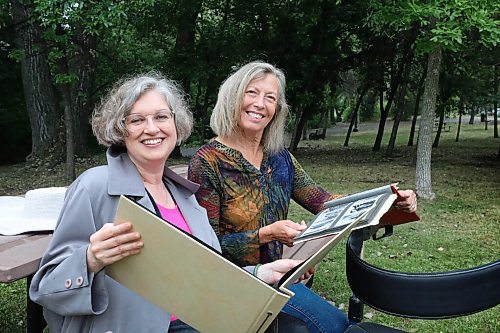 RUTH BONNEVILLE / WINNIPEG FREE PRESS

ENT - found family photos

Ingeborg Boyens (rear,colourful shirt) and Laurie Lam (blue coat) look through Ingeborg's the family photo album that Lam found in a second hand store, while sitting on a picnic bench at  Stephen Juba Park.  For Arts.

Laurie Lam found a long-forgotten photo album that belonged to Ingeborg's family at a second-hand store. The album contained childhood photos of Ingeborg growing up with her parents.  

The two have since become friends and have written about their experience in a piece that will be co-authored by them both. Since the two are around the same age they shared stories of growing up by comparing photos in their family albums. (Ingeborg Boyens feeding her cat and Laurie Lam holding a favourite book she loved, both loved playing in the snow). 

 Likely run late this week, or early next week.

July 20, 2021
