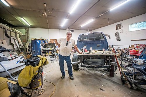 MIKAELA MACKENZIE / WINNIPEG FREE PRESS

Denis Gobeil, owner of Good'n Tension Auto Body in St. Adolphe, poses for a portrait in the garage on Wednesday, July 21, 2021. For Cody story.
Winnipeg Free Press 2021.