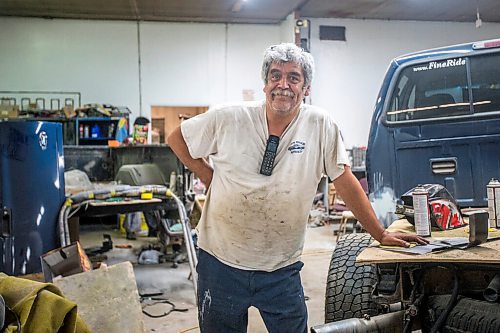 MIKAELA MACKENZIE / WINNIPEG FREE PRESS

Denis Gobeil, owner of Good'n Tension Auto Body in St. Adolphe, poses for a portrait in the garage on Wednesday, July 21, 2021. For Cody story.
Winnipeg Free Press 2021.