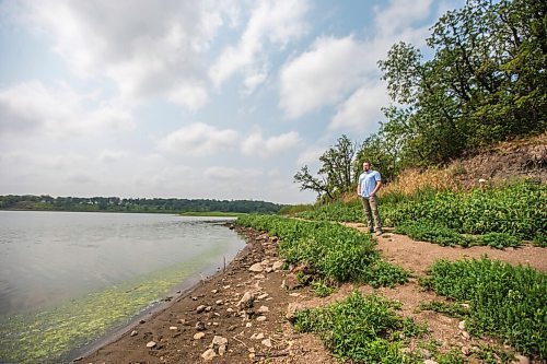 MIKAELA MACKENZIE / WINNIPEG FREE PRESS

Mayor Brandon Burley poses for a portrait on the bank at Lake Minnewasta, where the town of Morden gets its water, on Thursday, July 22, 2021. The normal water line is above him, up by the trees. For Kevin Rollason story.
Winnipeg Free Press 2021.