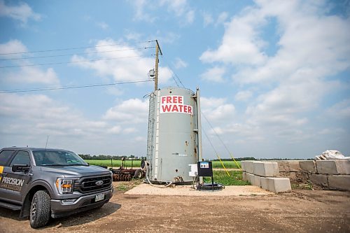 MIKAELA MACKENZIE / WINNIPEG FREE PRESS

An 81,000-litre tank of free water gathered with an underground tile system at Precision Land Solutions near Morden on Thursday, July 22, 2021.Residents have been coming by to fill tanks for vegetable gardens. For Kevin Rollason story.
Winnipeg Free Press 2021.