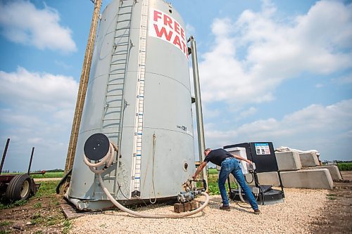 MIKAELA MACKENZIE / WINNIPEG FREE PRESS

Darrel Friesen shows the 81,000-litre tank of free water that Precision Land Solutions has gathered with an underground tile system near Morden on Thursday, July 22, 2021. For Kevin Rollason story.
Winnipeg Free Press 2021.