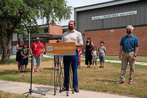 ALEX LUPUL / WINNIPEG FREE PRESS  

NDP Leader Wab Kinew speaks, while NDP Education Critic Nello Altomare looks on, during a press conference outside of Churchill High School in Winnipeg on Thursday, July 22, 2021. Kinew and local parents spoke about the need to improve ventilation in schools before classes resume in the fall.