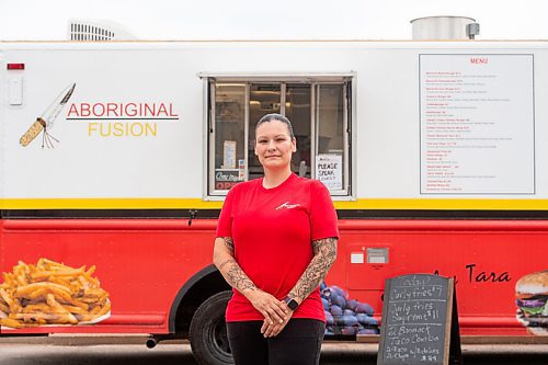 MIKE SUDOMA / Winnipeg Free Press
Tara Hall, owner and chef of Aboriginal Fusion, in front of her food truck parked in the parking lot of Weston Community Centre Thursday afternoon
July 22, 2021