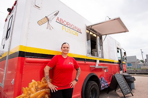 MIKE SUDOMA / Winnipeg Free Press
Tara Hall, owner and chef of Aboriginal Fusion, in front of her food truck parked in the parking lot of Weston Community Centre Thursday afternoon
July 22, 2021