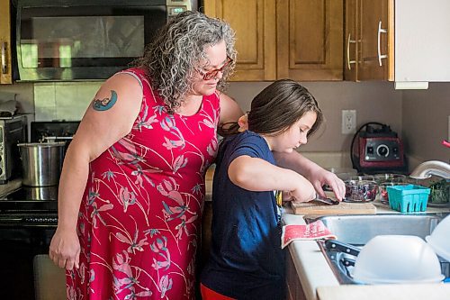 MIKAELA MACKENZIE / WINNIPEG FREE PRESS

Céline Land and her son, Félix (nine), cut cherries together while making a summer bruschetta with Vegan Fromagerie feta at home in Winnipeg on Friday, July 23, 2021. For Eva Wasney story.
Winnipeg Free Press 2021.