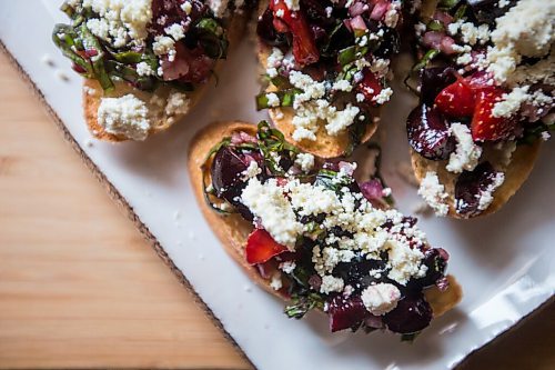 MIKAELA MACKENZIE / WINNIPEG FREE PRESS

Summer bruschetta with Vegan Fromagerie feta at the Land home in Winnipeg on Friday, July 23, 2021. For Eva Wasney story.
Winnipeg Free Press 2021.